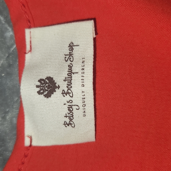 Betsy's Boutique Shop Red Short Sleeve with Bows Button Down V- Neck Top. - Picture 3 of 9